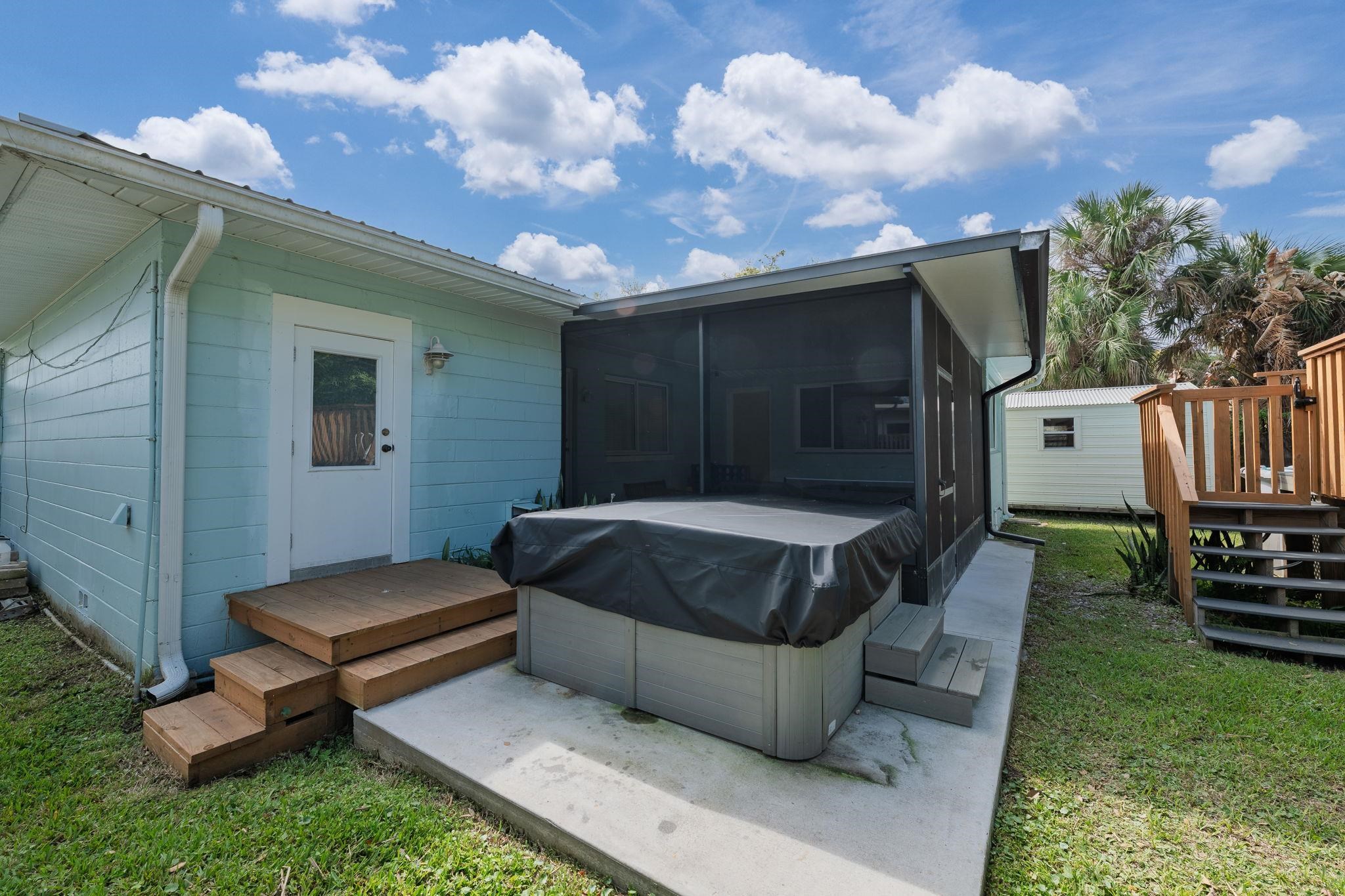 119 Menendez Road St. Augustine, FL 32080 - Photo 29 of 40 a view of backyard with barbeque grill and a fireplace