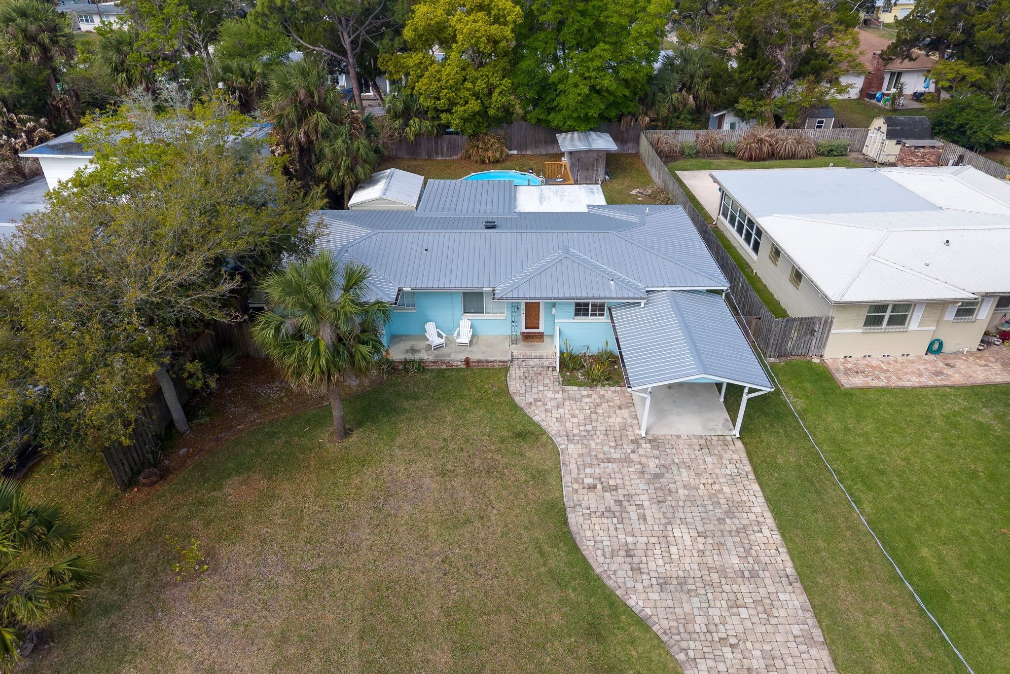 119 Menendez Road St. Augustine, FL 32080 - Photo 32 of 40 an aerial view of a house with garden space and a patio