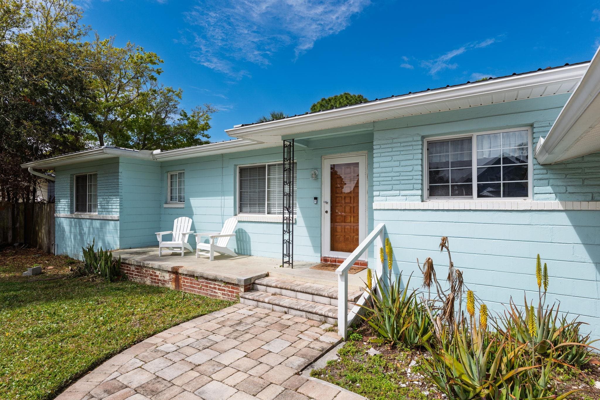 119 Menendez Road St. Augustine, FL 32080 - Photo 34 of 40 a front view of a house with garden