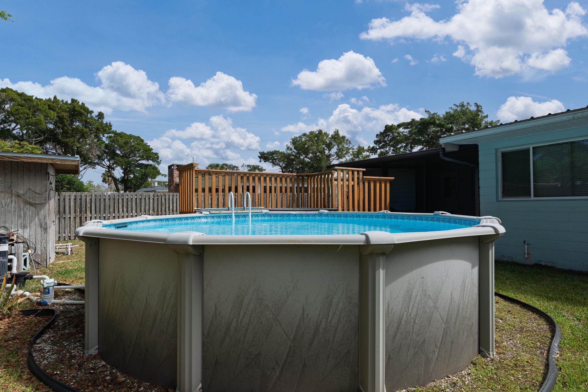 119 Menendez Road St. Augustine, FL 32080 - Photo 37 of 40 a view of a backyard with a sink and a table and potted plants