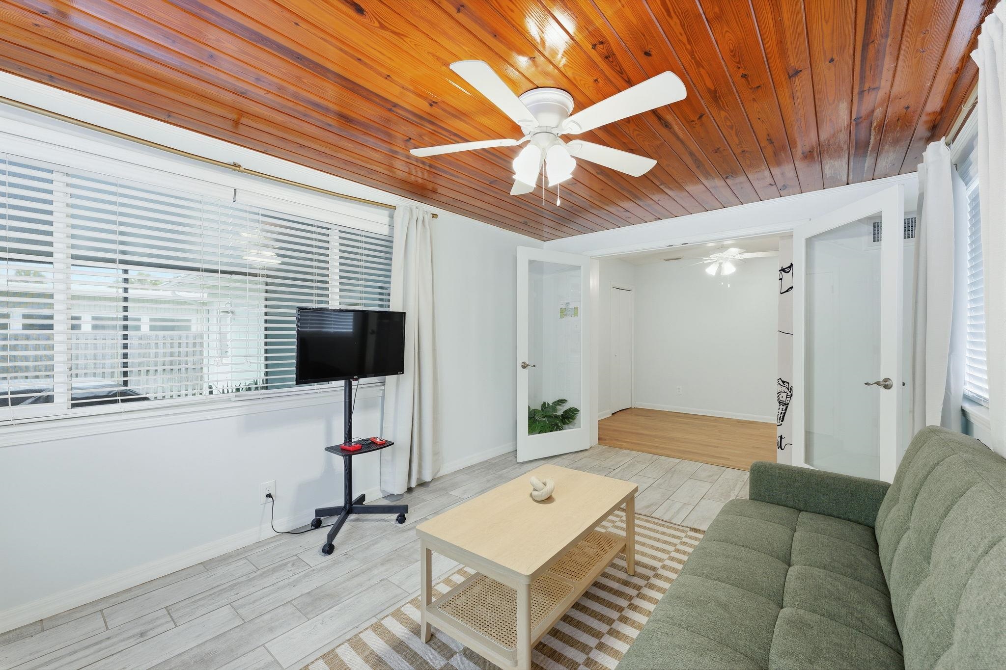 119 Menendez Road St. Augustine, FL 32080 - Photo 4 of 40 a living room with furniture and a flat screen tv