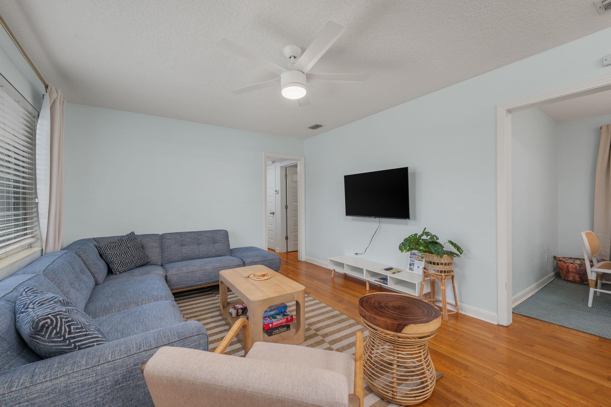 119 Menendez Road St. Augustine, FL 32080 - Photo 6 of 40 a living room with furniture and a flat screen tv