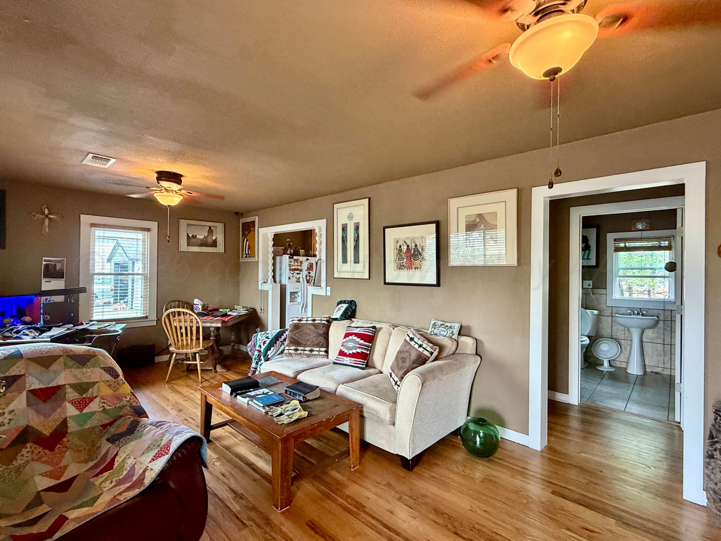 701 Brain Street Borger, TX 79007 - Photo 10 of 18 a living room with furniture and a wooden floor