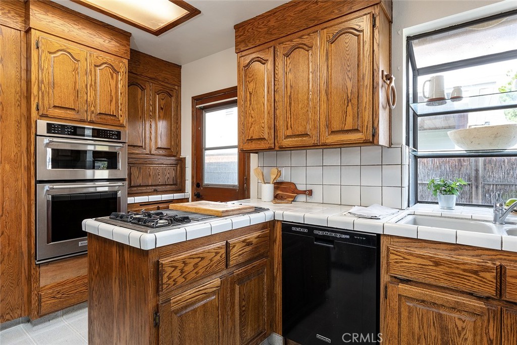 5343 Marshburn Avenue Arcadia, CA 91006 - Photo 9 of 25 a kitchen with stainless steel appliances granite countertop a sink stove and refrigerator