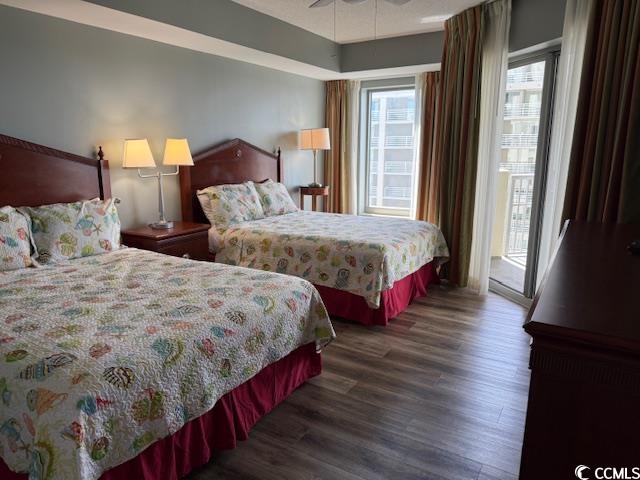 9994 Beach Club Drive, Unit 1204 Myrtle Beach, SC 29572 - Photo 21 of 36 Bedroom with access to outside, dark wood-style flooring, and a ceiling fan