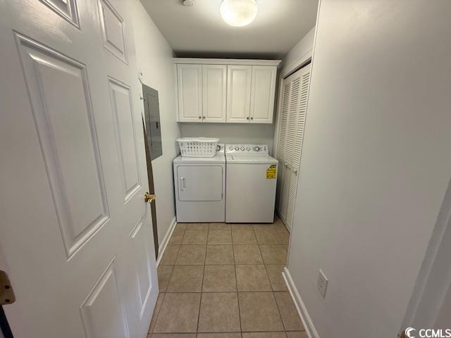 9994 Beach Club Drive, Unit 1204 Myrtle Beach, SC 29572 - Photo 25 of 36 Laundry room with light tile patterned flooring, cabinet space, washer and clothes dryer, and electric panel