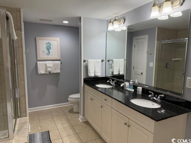 9994 Beach Club Drive, Unit 1204 Myrtle Beach, SC 29572 - Photo 27 of 36 Bathroom with a shower stall, double vanity, light tile patterned floors, and recessed lighting