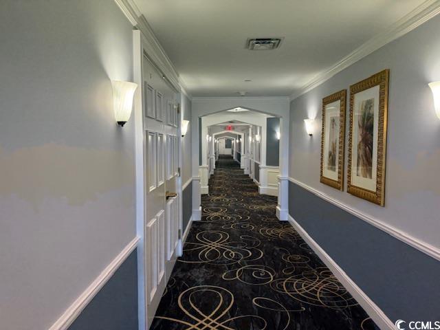 9994 Beach Club Drive, Unit 1204 Myrtle Beach, SC 29572 - Photo 32 of 36 Hall featuring crown molding and arched walkways