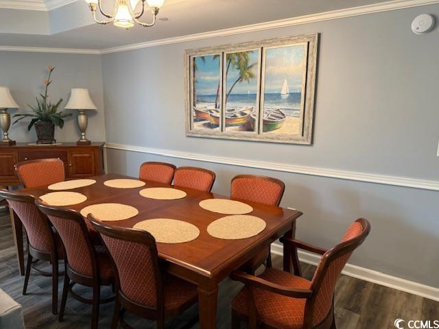 9994 Beach Club Drive, Unit 1204 Myrtle Beach, SC 29572 - Photo 4 of 36 Dining room featuring ornamental molding, a chandelier, and dark wood-style floors