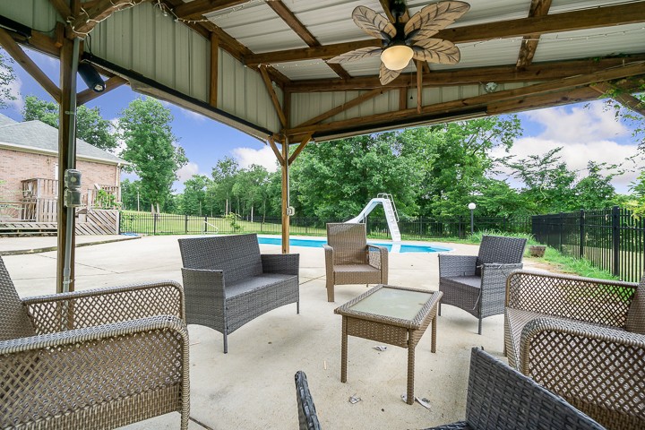 162 Hiwassee Road Lebanon, TN 37087 - Photo 14 of 50 a view of a patio with a table chairs and a floor to ceiling window