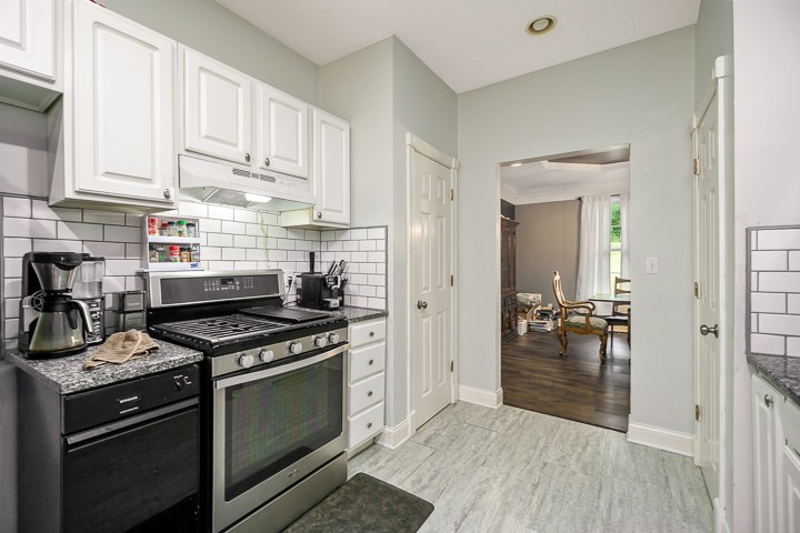 162 Hiwassee Road Lebanon, TN 37087 - Photo 22 of 50 a kitchen with stainless steel appliances granite countertop a stove and a refrigerator