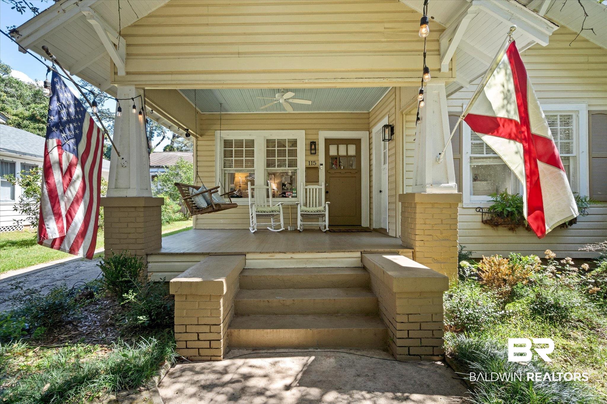 115 Bienville Avenue Mobile, AL 36606 - Photo 2 of 19 View of exterior entry featuring covered porch