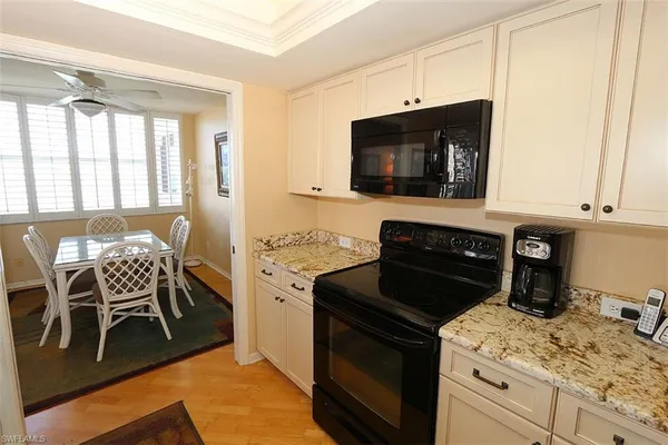 a kitchen with a stove and a microwave