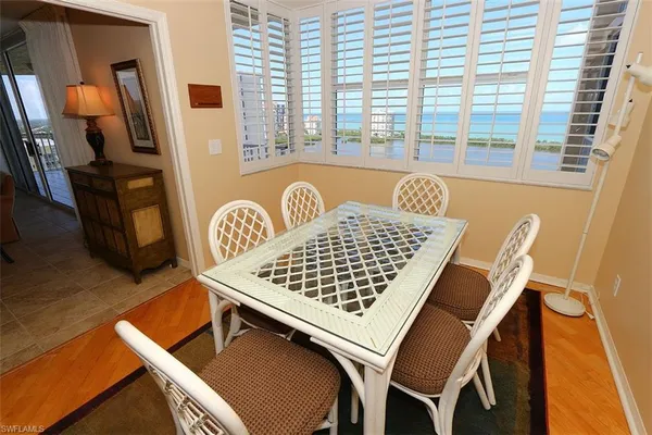 a view of a dining room with furniture and window