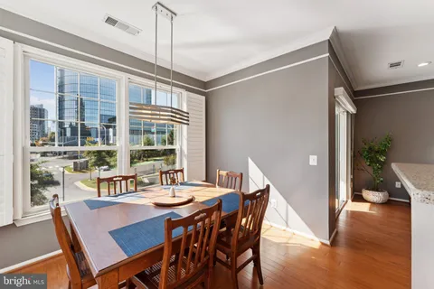 a dining room with furniture window wooden floor