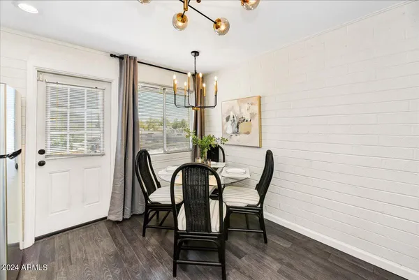 a view of a dining room with furniture window and wooden floor