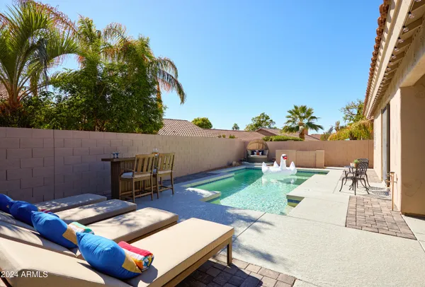 a view of a backyard with sitting area