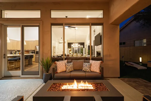 a view of a swimming pool with outdoor seating