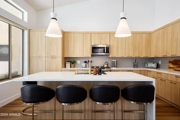 a bedroom with a large bed and a couch