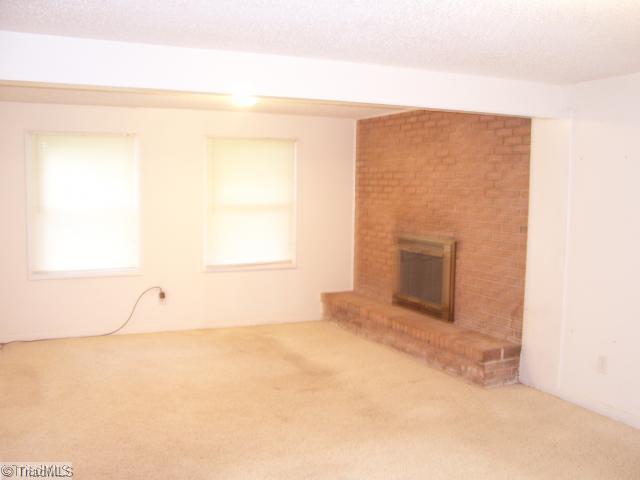 6040 Parnell Road Winston-Salem, NC 27107 - Photo 14 of 15 Den/Family/Great Room. Den with Fireplace in Basement
