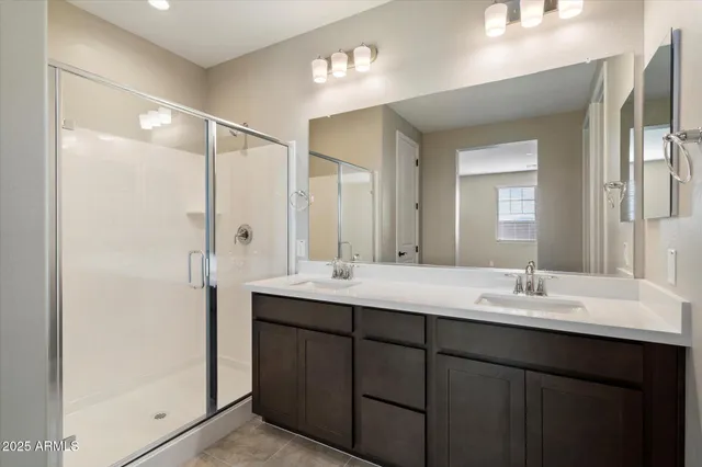 a bathroom with a double vanity sink mirror and double