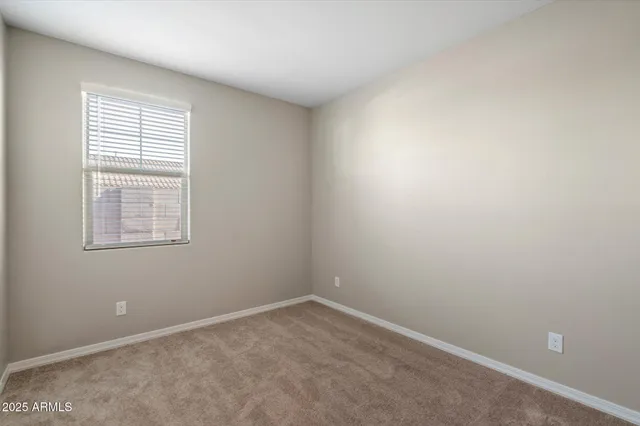 a bathroom with a sink vanity mirror and toilet