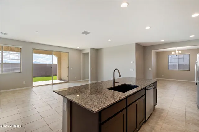 a kitchen with granite countertop a sink and a granite counter tops