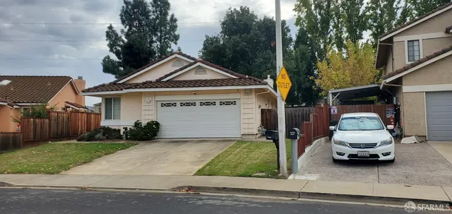 a view of a car in front of house