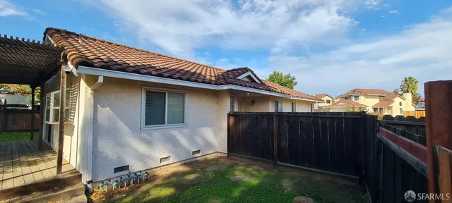 a view of house with wooden fence