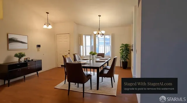 a view of a dining room with furniture and chandelier