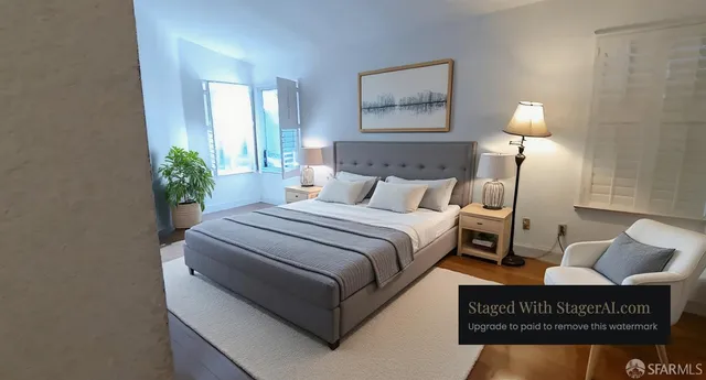 a bedroom with a bed and a lamp