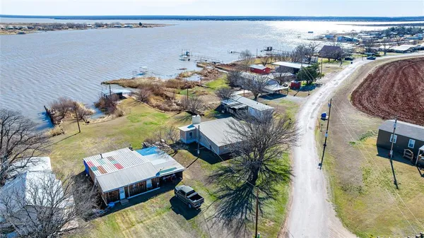 an aerial view of a house with outdoor space