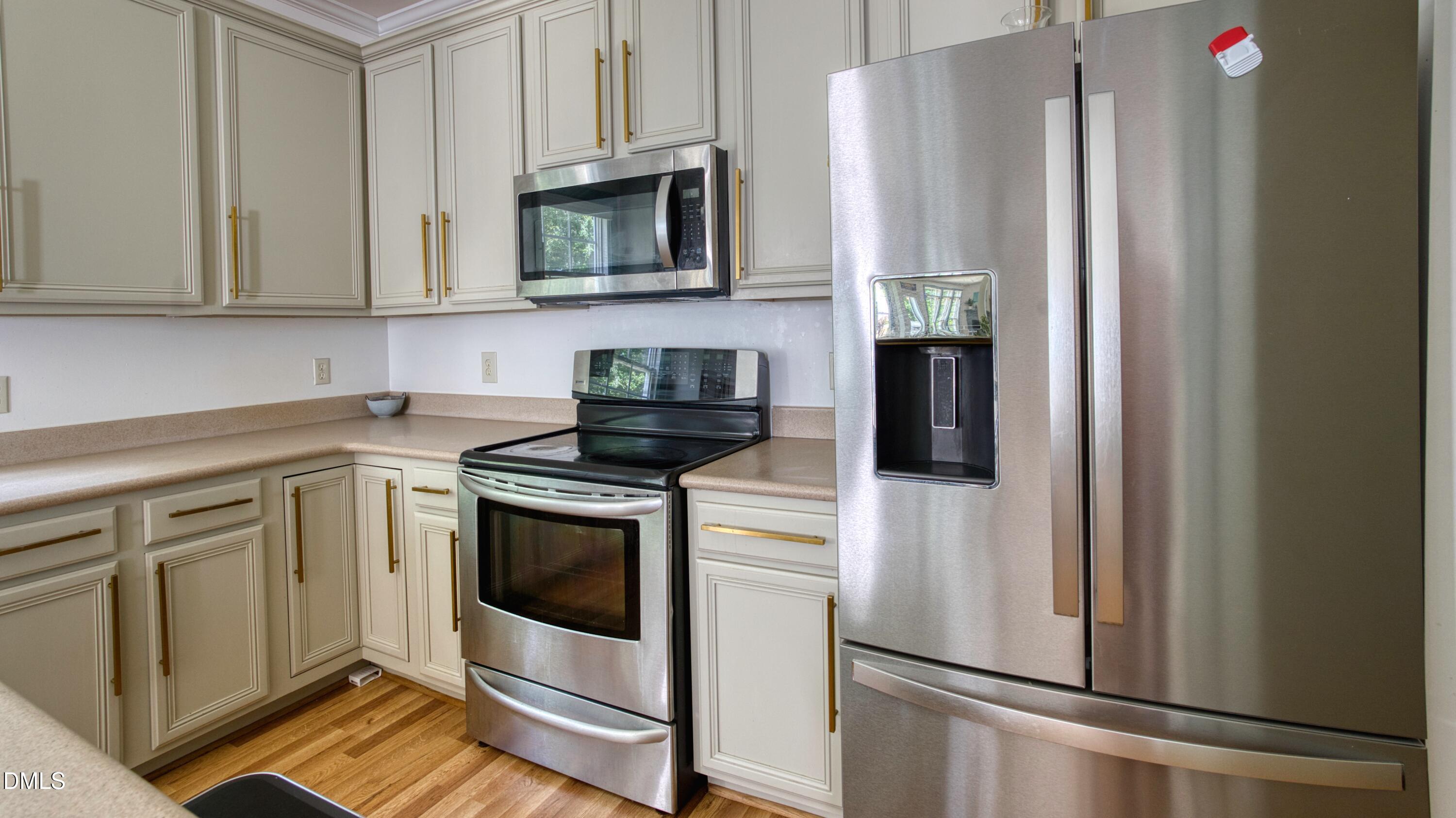 7 Monteith Court Durham, NC 27713 - Photo 25 of 44 a kitchen with stainless steel appliances granite countertop a refrigerator sink and stove