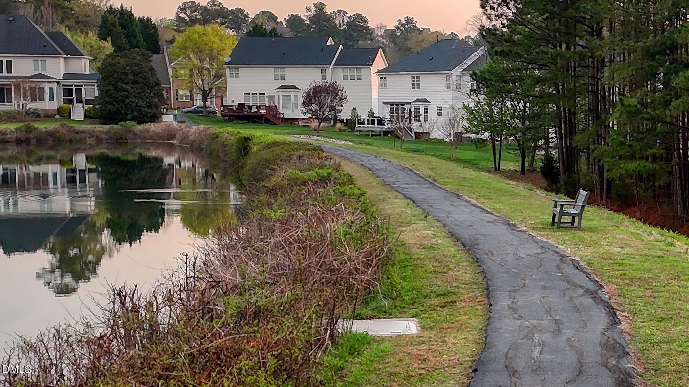 7 Monteith Court Durham, NC 27713 - Photo 3 of 44 a view of a lake with a house
