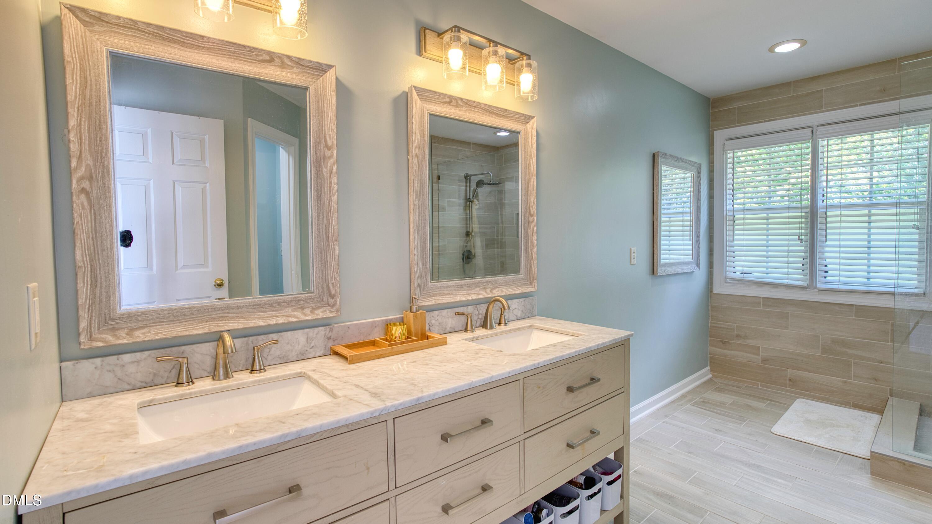 7 Monteith Court Durham, NC 27713 - Photo 35 of 44 a bathroom with a sink and a mirror