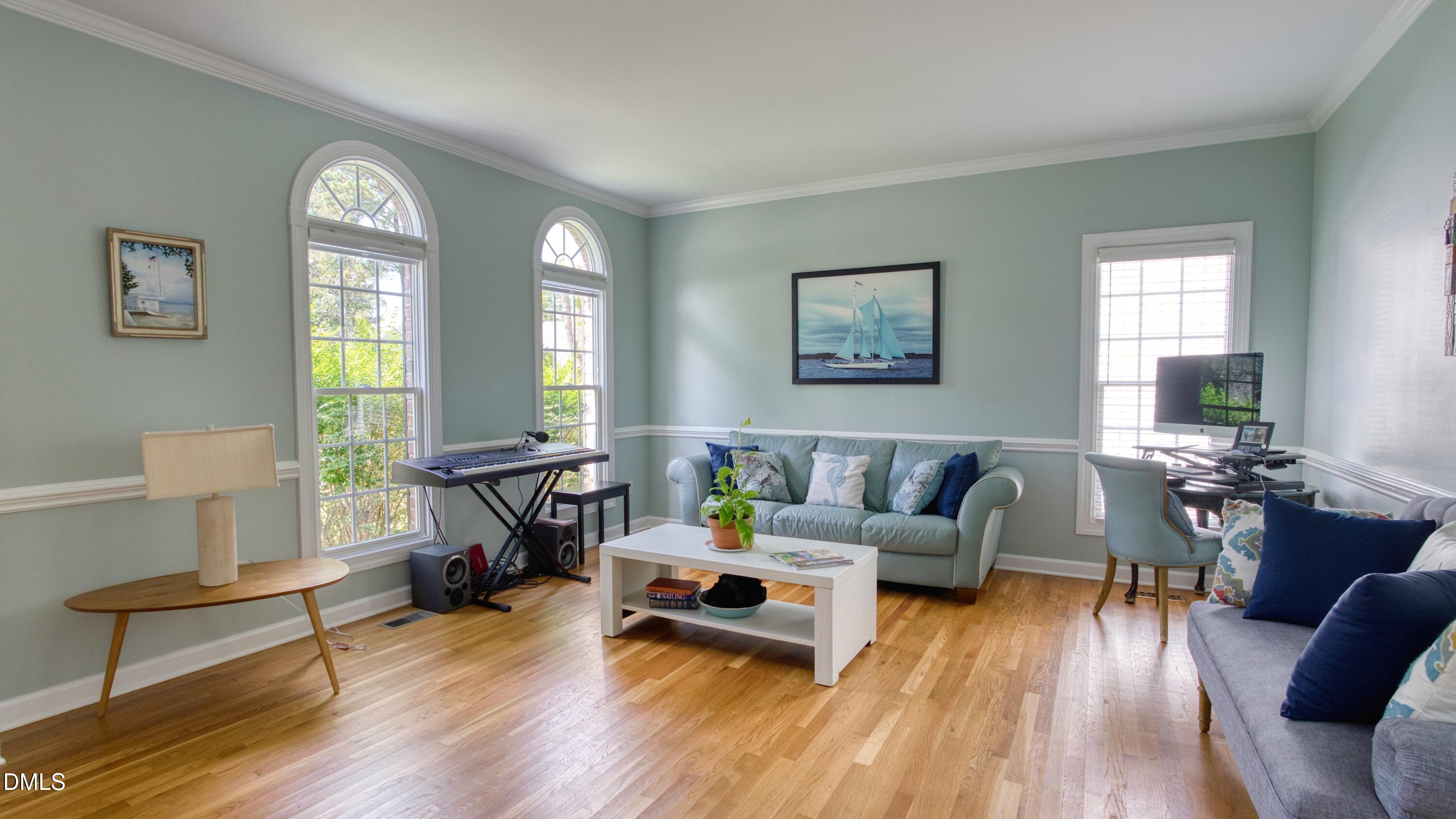 7 Monteith Court Durham, NC 27713 - Photo 7 of 44 a living room with furniture and wooden floor