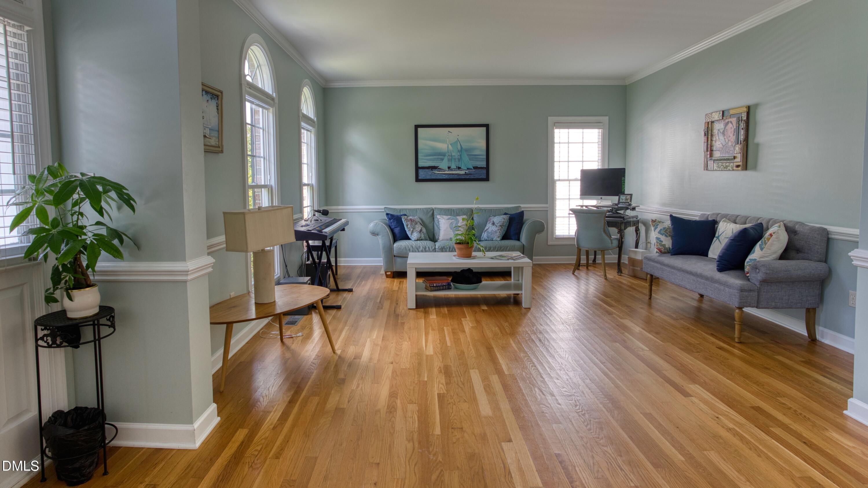 7 Monteith Court Durham, NC 27713 - Photo 8 of 44 a living room with furniture and a wooden floor