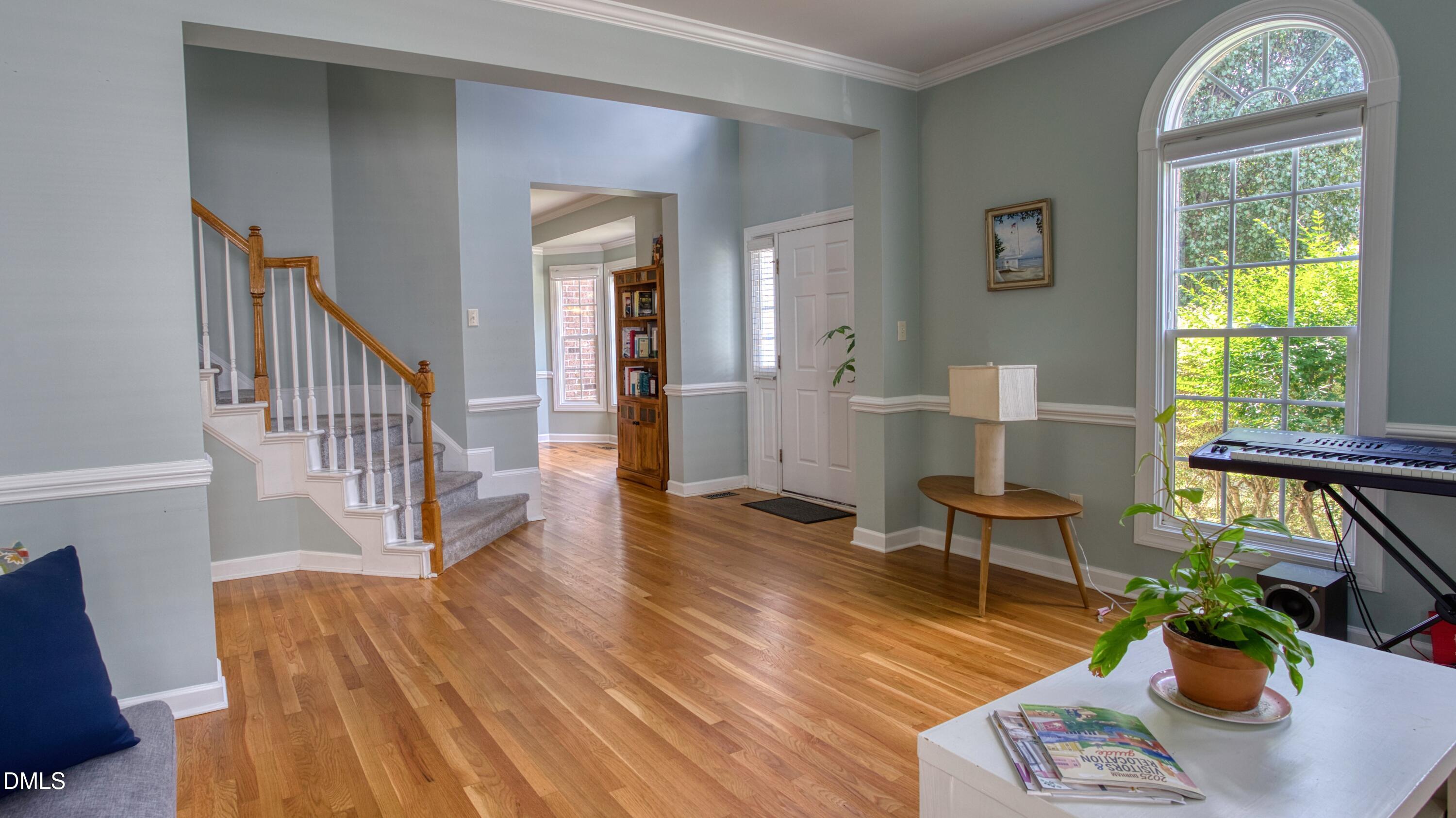 7 Monteith Court Durham, NC 27713 - Photo 9 of 44 a view of a livingroom with furniture wooden floor and a window