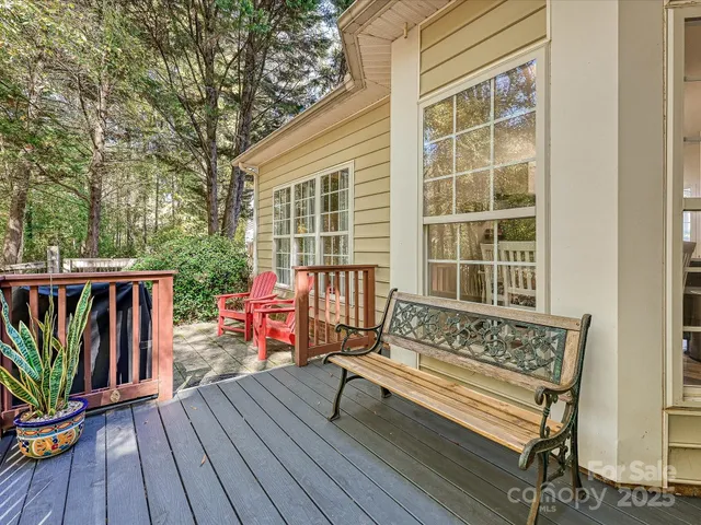 a view of a two chairs in the backyard