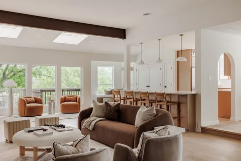 a view of a livingroom with furniture window and wooden floor