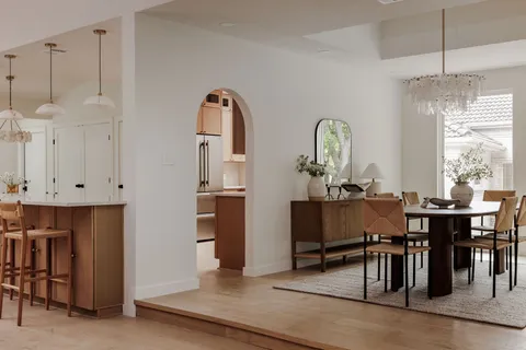a view of a dining room with furniture and window