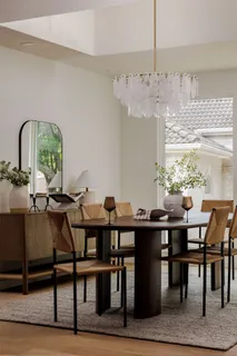 a dining room with furniture window and outside view