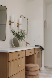 a bathroom with a granite countertop shower