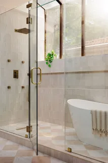 a bathroom with a mirror and vanity