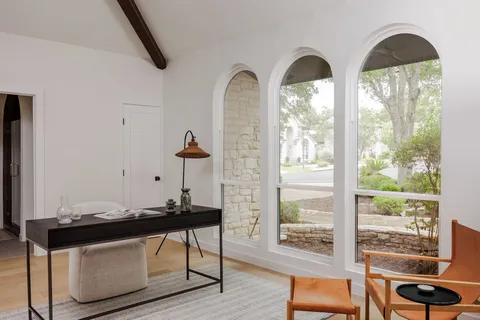 a bathroom with a glass shower door