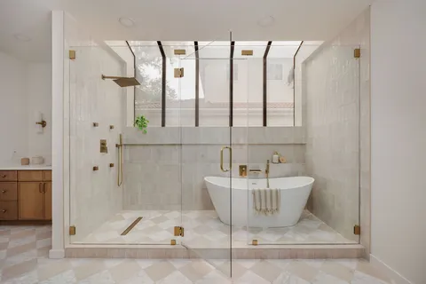 a bathroom with a bathtub and a shower