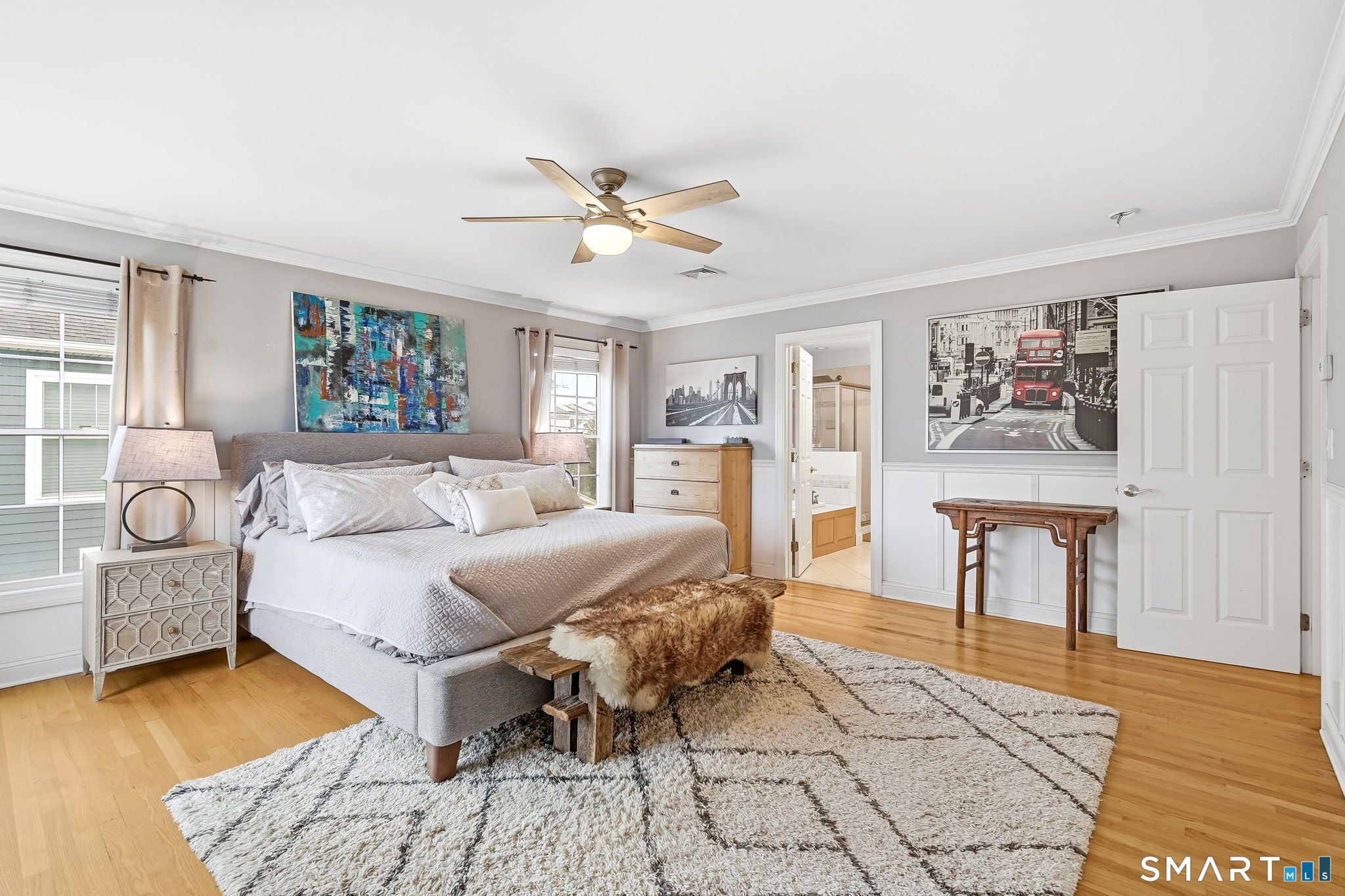 80 3rd Avenue Stratford, CT 06615 - Photo 24 of 40 a bedroom with a large bed a table and chair