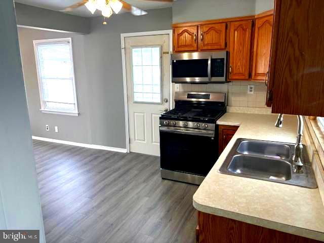 50 Gerard Road Hamilton, NJ 08620 - Photo 11 of 19 a kitchen with a stove and a microwave