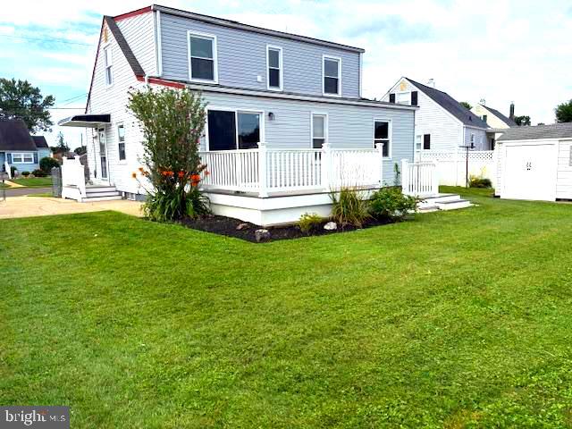 50 Gerard Road Hamilton, NJ 08620 - Photo 3 of 19 a view of a white house with a big yard potted plants and large tree