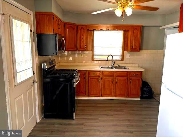 50 Gerard Road Hamilton, NJ 08620 - Photo 10 of 19 a kitchen with stainless steel appliances granite countertop a sink stove and refrigerator